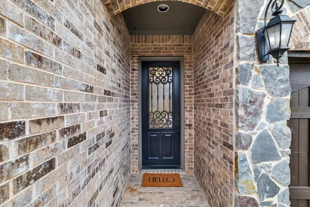 view of a brick wall with a door