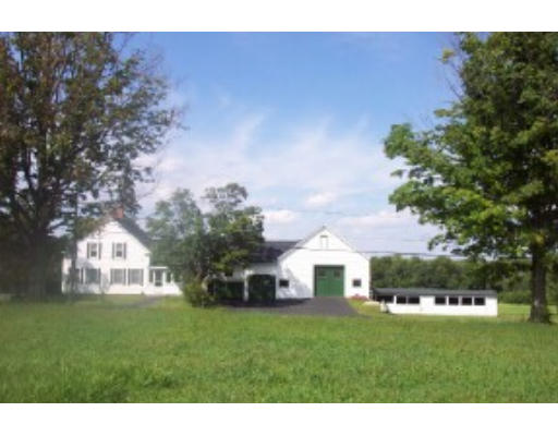 90 North End Road Townsend, MA 01469 - Photo 1 of 2 a view of a white house with a big yard plants and large trees