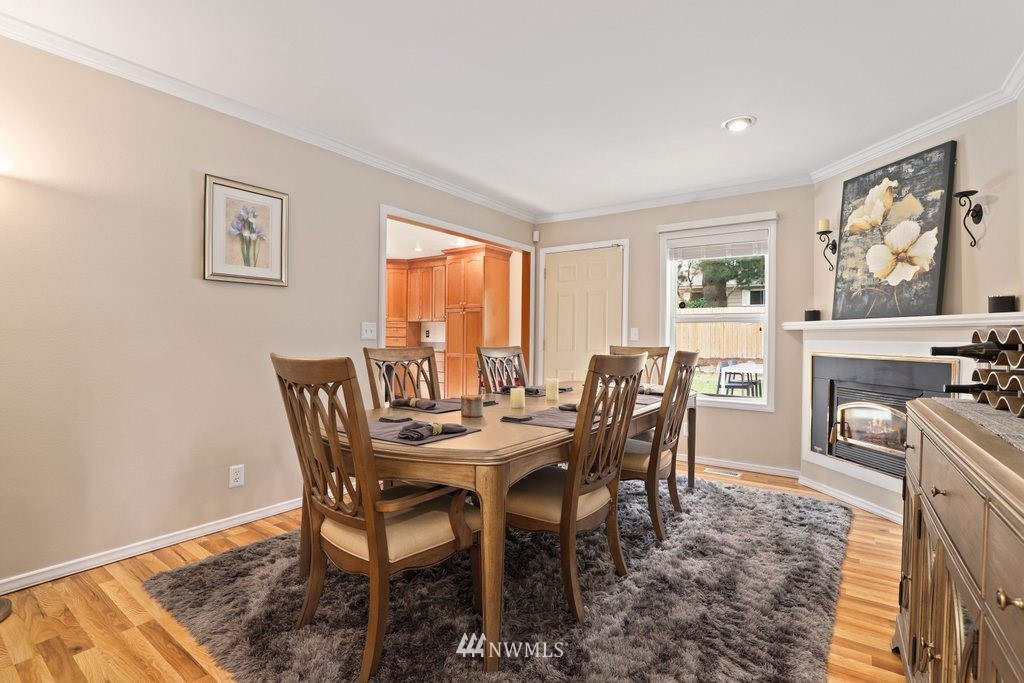 19402 Winesap Road Bothell, WA 98012 - Photo 13 of 35 a view of a dining room with furniture window and wooden floor
