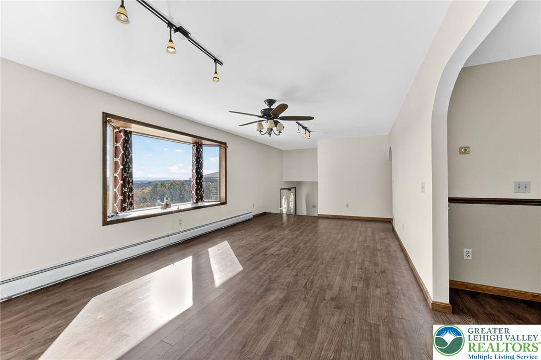 394 Flagstaff Road Lehighton, PA 18235 - Photo 16 of 75 a view of a hallway with wooden floor and a chandelier