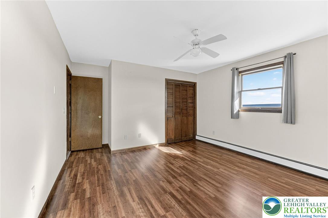 394 Flagstaff Road Lehighton, PA 18235 - Photo 27 of 75 a view of an empty room with wooden floor and a window