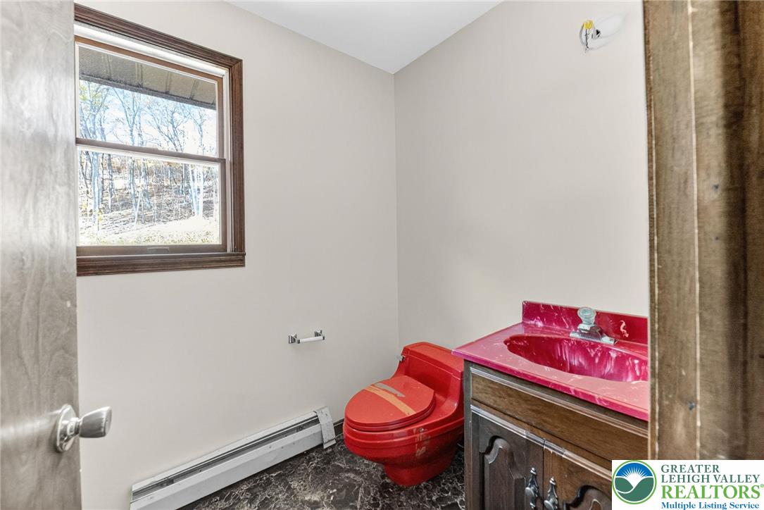 394 Flagstaff Road Lehighton, PA 18235 - Photo 30 of 75 a bathroom with a toilet sink and vanity