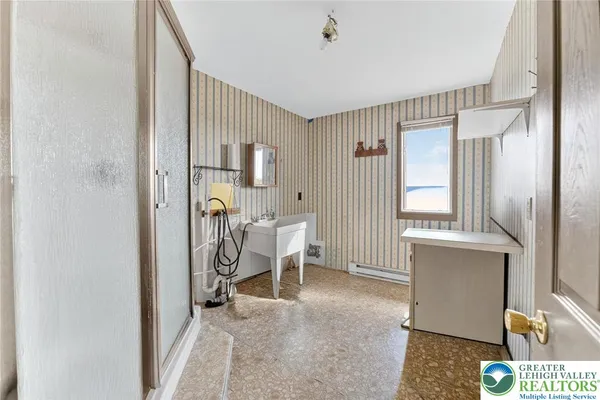 a bathroom with a toilet and a sink