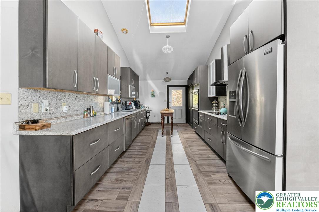 394 Flagstaff Road Lehighton, PA 18235 - Photo 40 of 75 a kitchen with stainless steel appliances a refrigerator sink and cabinets