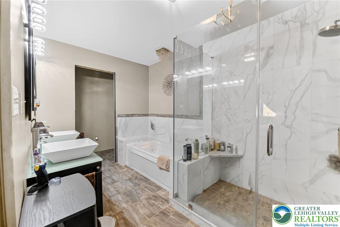 394 Flagstaff Road Lehighton, PA 18235 - Photo 50 of 75 a bathroom with a sink a mirror and a shower