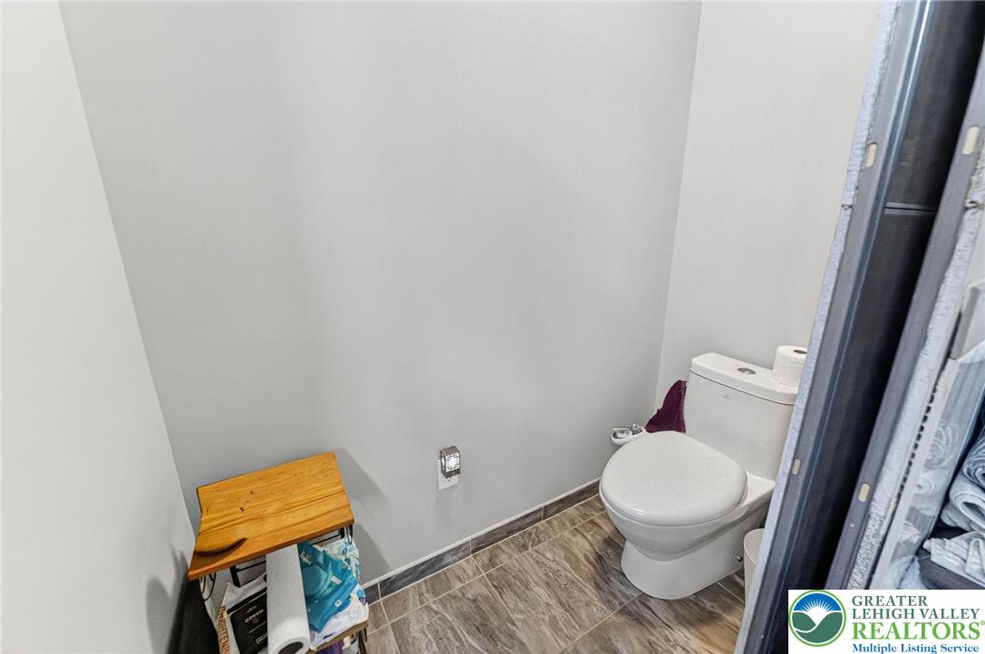 394 Flagstaff Road Lehighton, PA 18235 - Photo 52 of 75 a white toilet sitting next to a small window