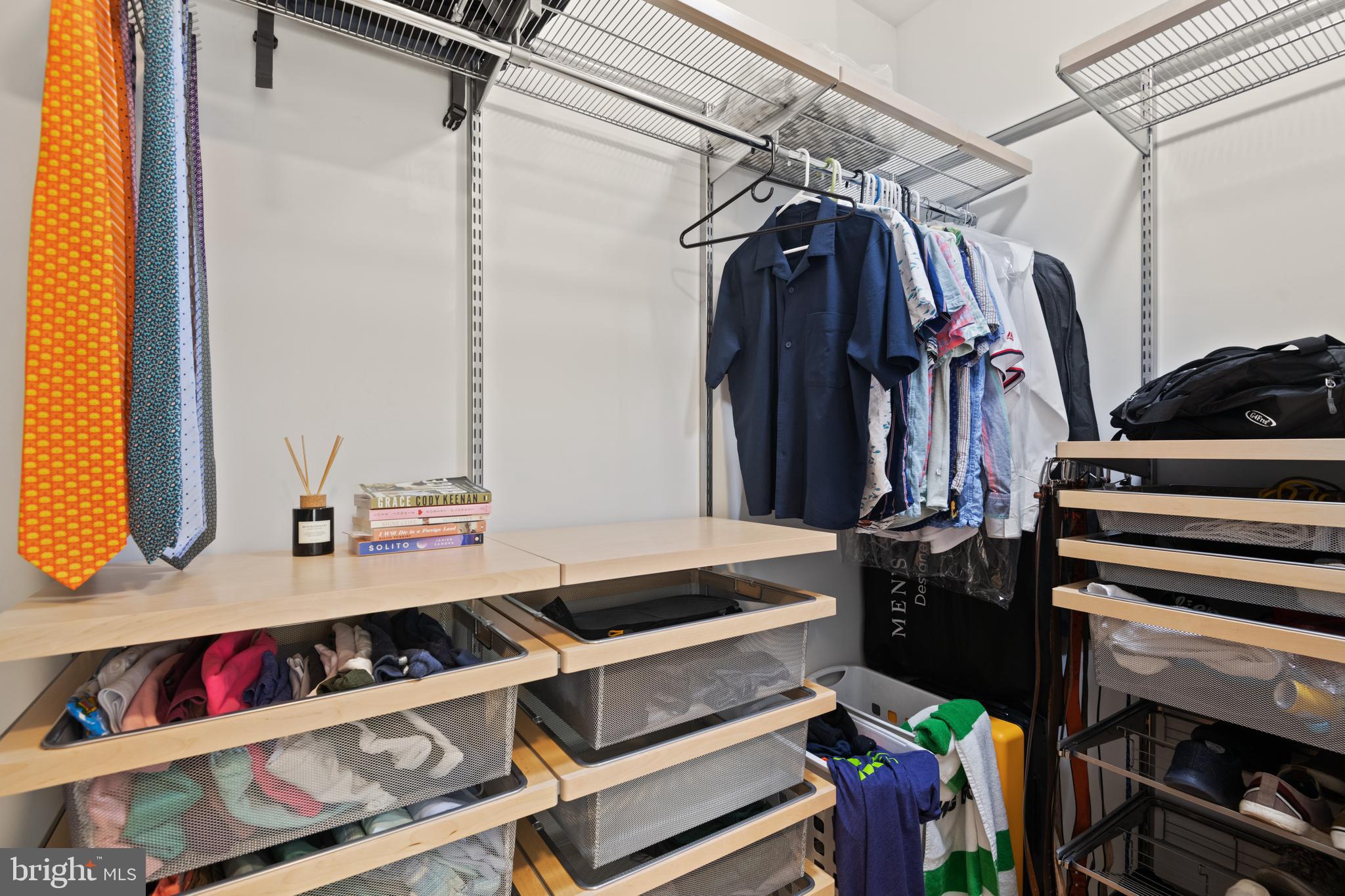 1436 Chapin Street Northwest, Unit F Washington, DC 20009 - Photo 30 of 41 a view of walk in closet with clothes and shoes