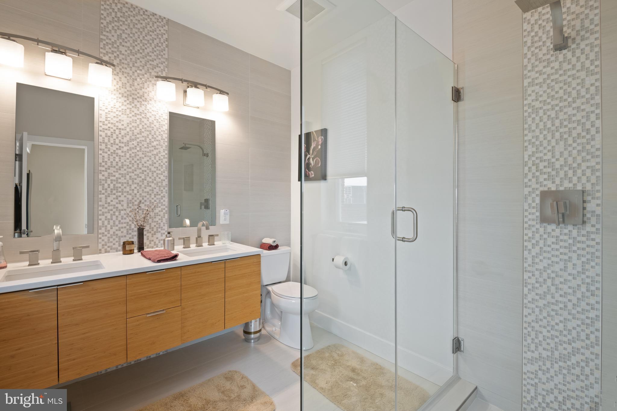 1436 Chapin Street Northwest, Unit F Washington, DC 20009 - Photo 33 of 41 a bathroom with a sink and mirror