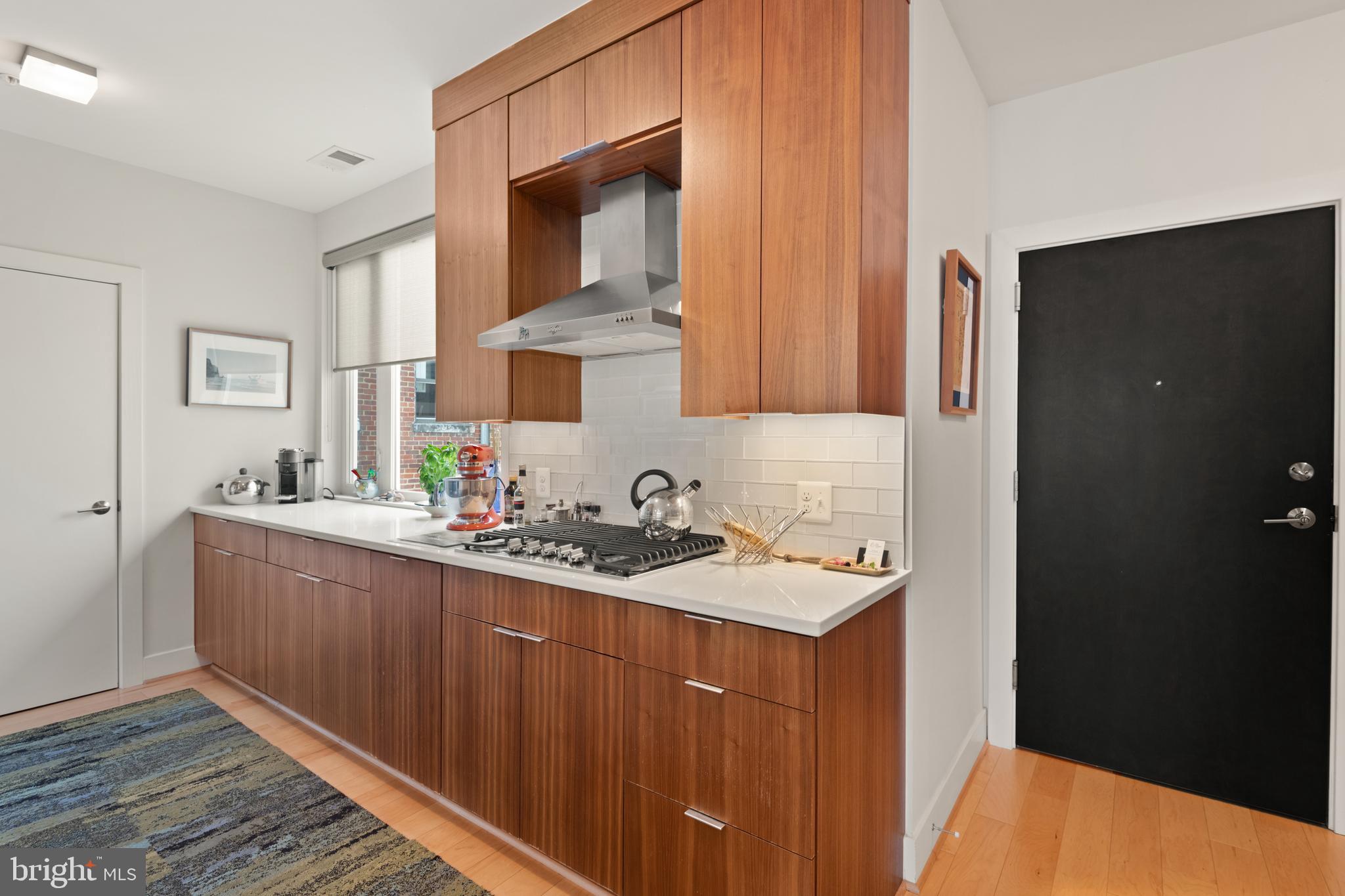 1436 Chapin Street Northwest, Unit F Washington, DC 20009 - Photo 9 of 41 a kitchen with sink and cabinets