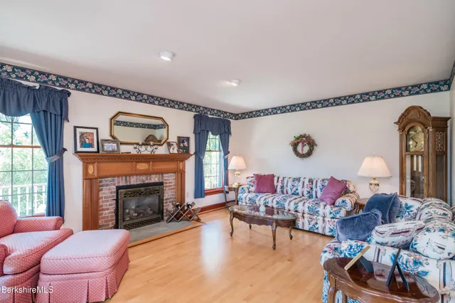 a view of a dining room with furniture and chandelier