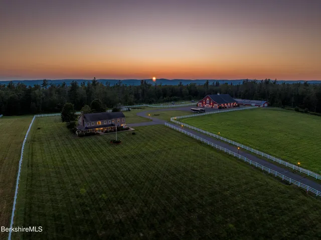 a view of a pool in a backyard of the house