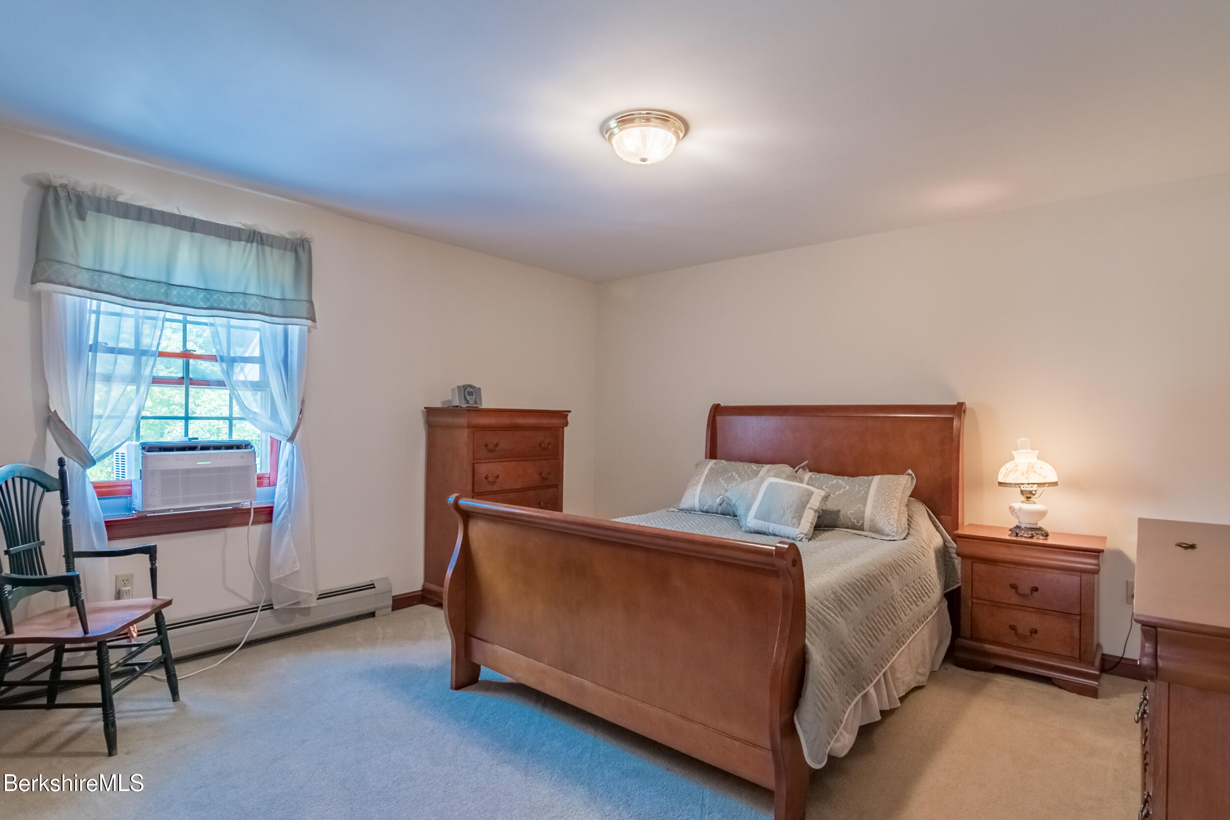 31 N Road Chesterfield, MA 01012 - Photo 29 of 50 a bedroom with a bed and wooden floor