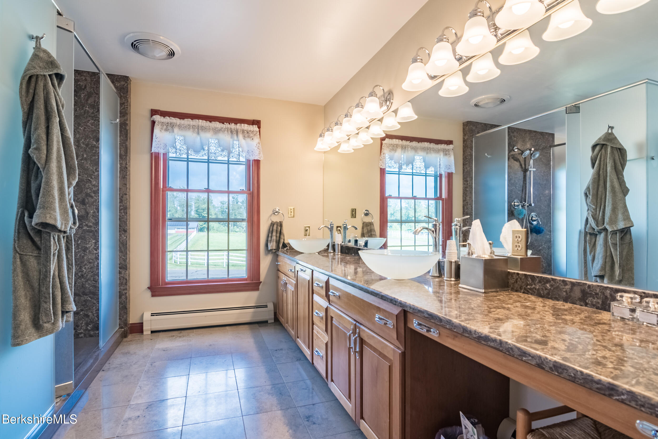 31 N Road Chesterfield, MA 01012 - Photo 35 of 50 a bathroom with sinks a large mirror and a shower