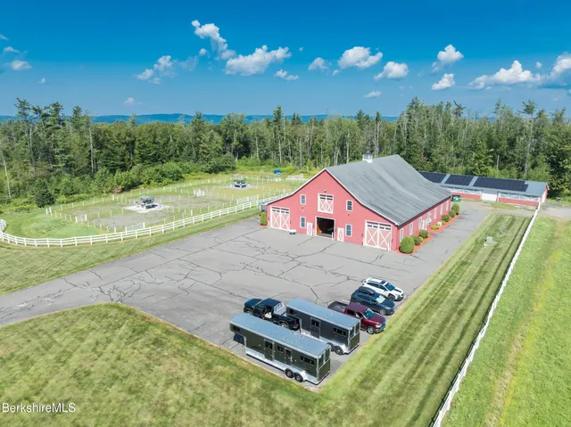 a view of a swimming pool and a yard