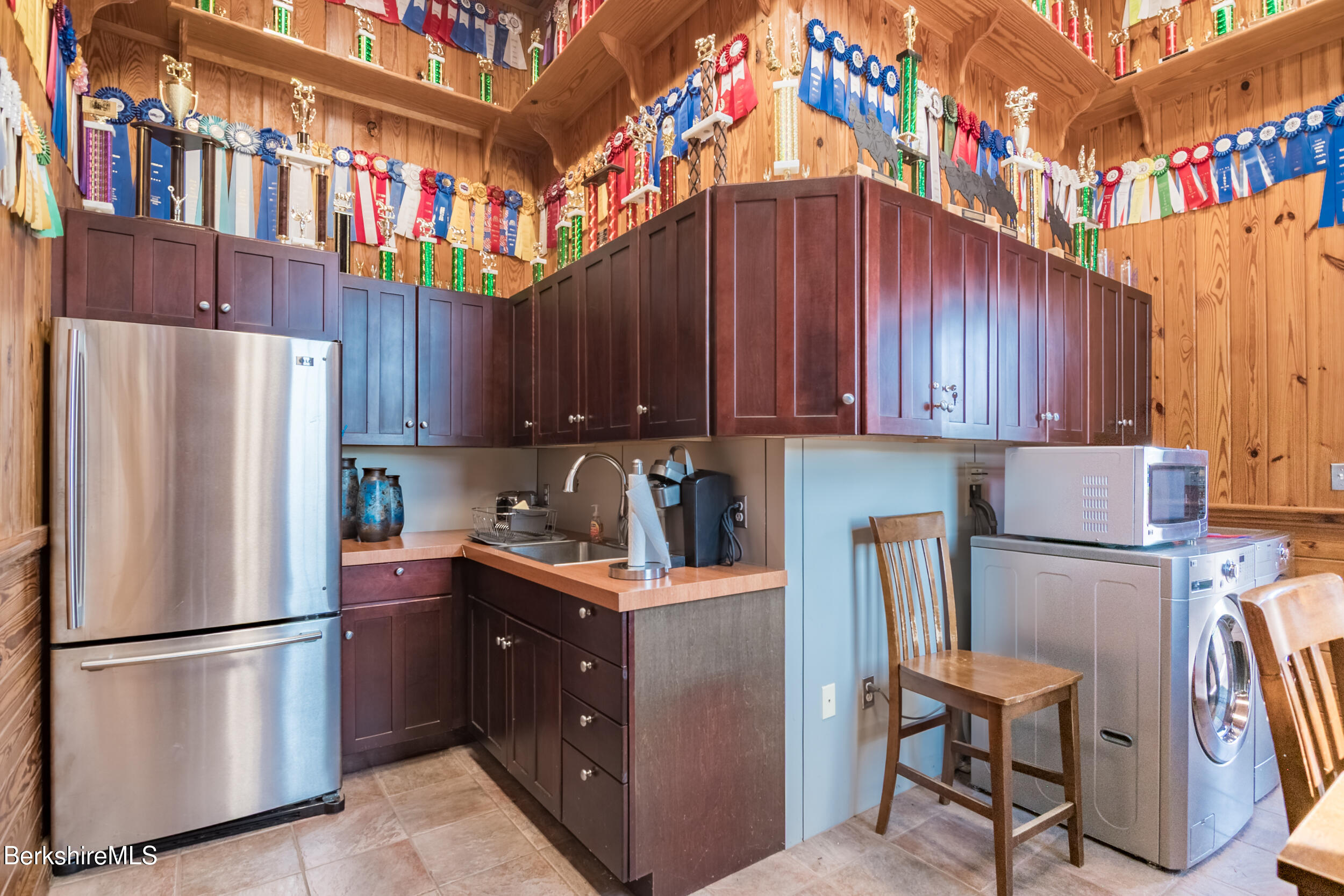 31 N Road Chesterfield, MA 01012 - Photo 48 of 50 a kitchen with stainless steel appliances granite countertop a refrigerator a stove a sink and dishwasher with wooden cabinets