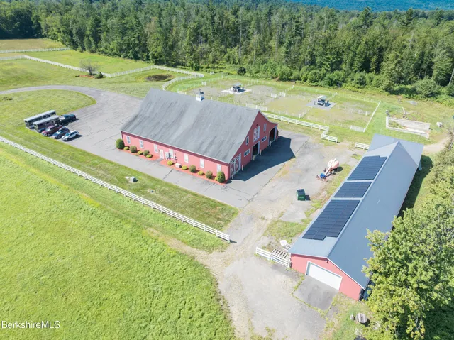 a view of a swimming pool with a yard