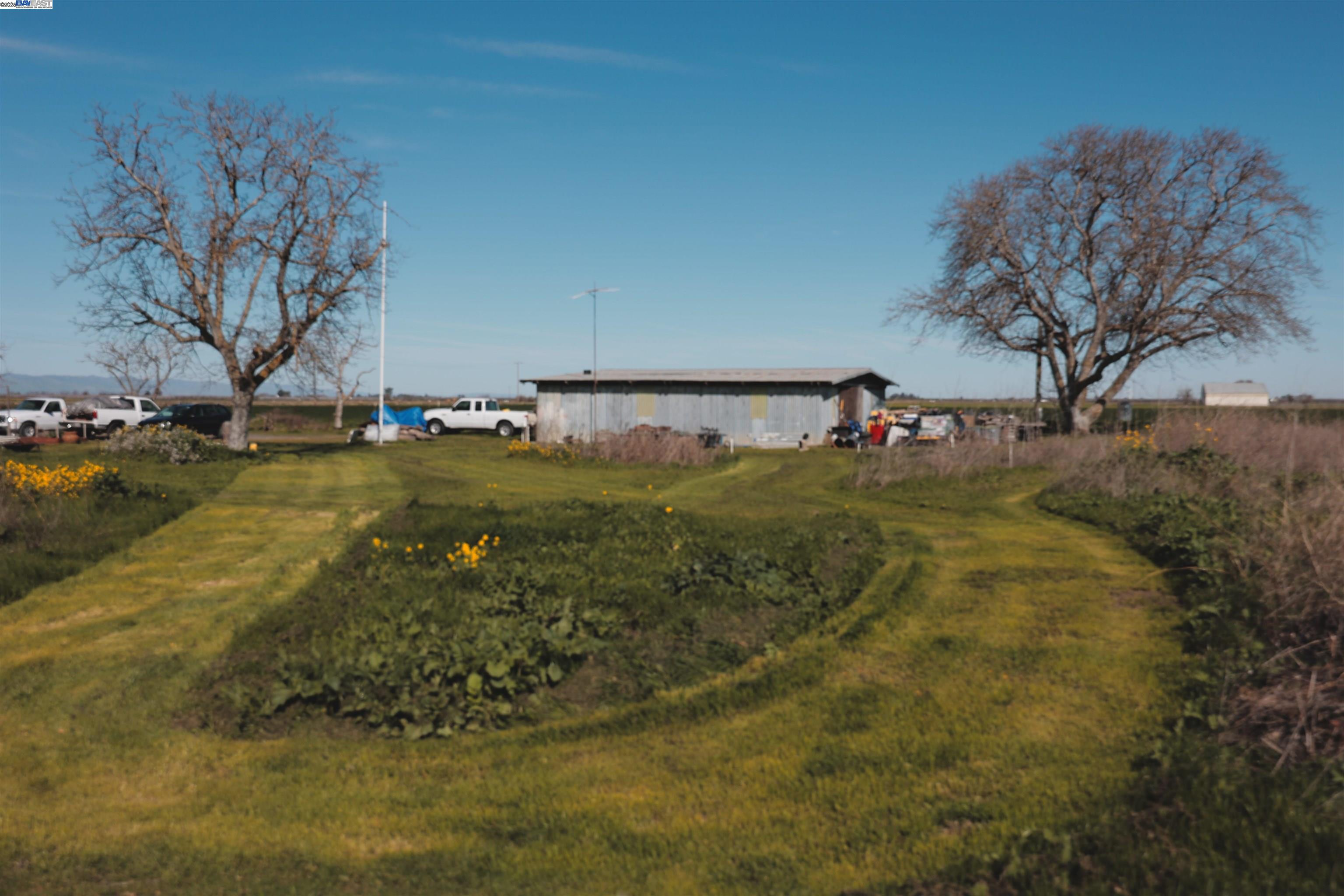 6282 Rio Dixon Road Dixon, CA 95620 - Photo 7 of 8 a view of a swimming pool with an outdoor space and seating area