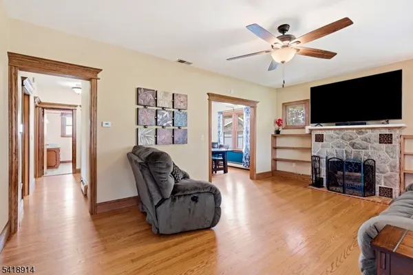 a living room with a table and chairs
