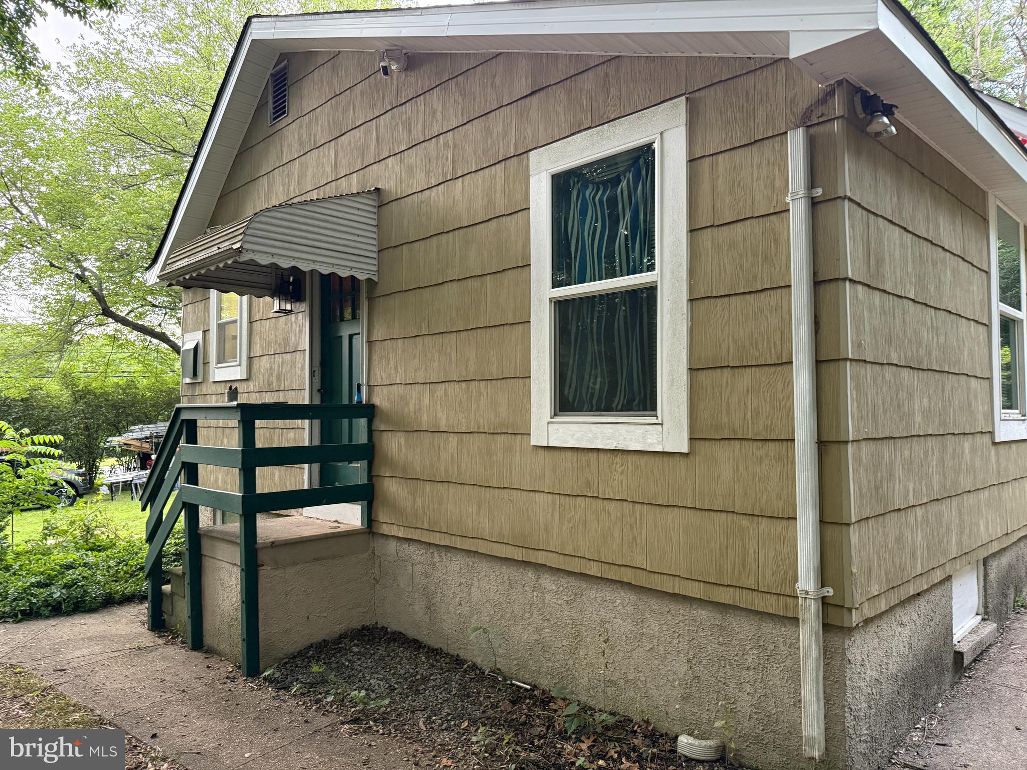 6650 Montgomery Road Elkridge, MD 21075 - Photo 28 of 36 a front view of a house with a yard