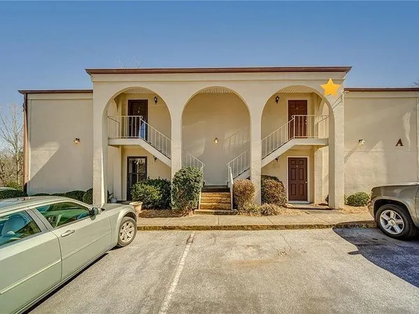 a view of a car parked in front of a house