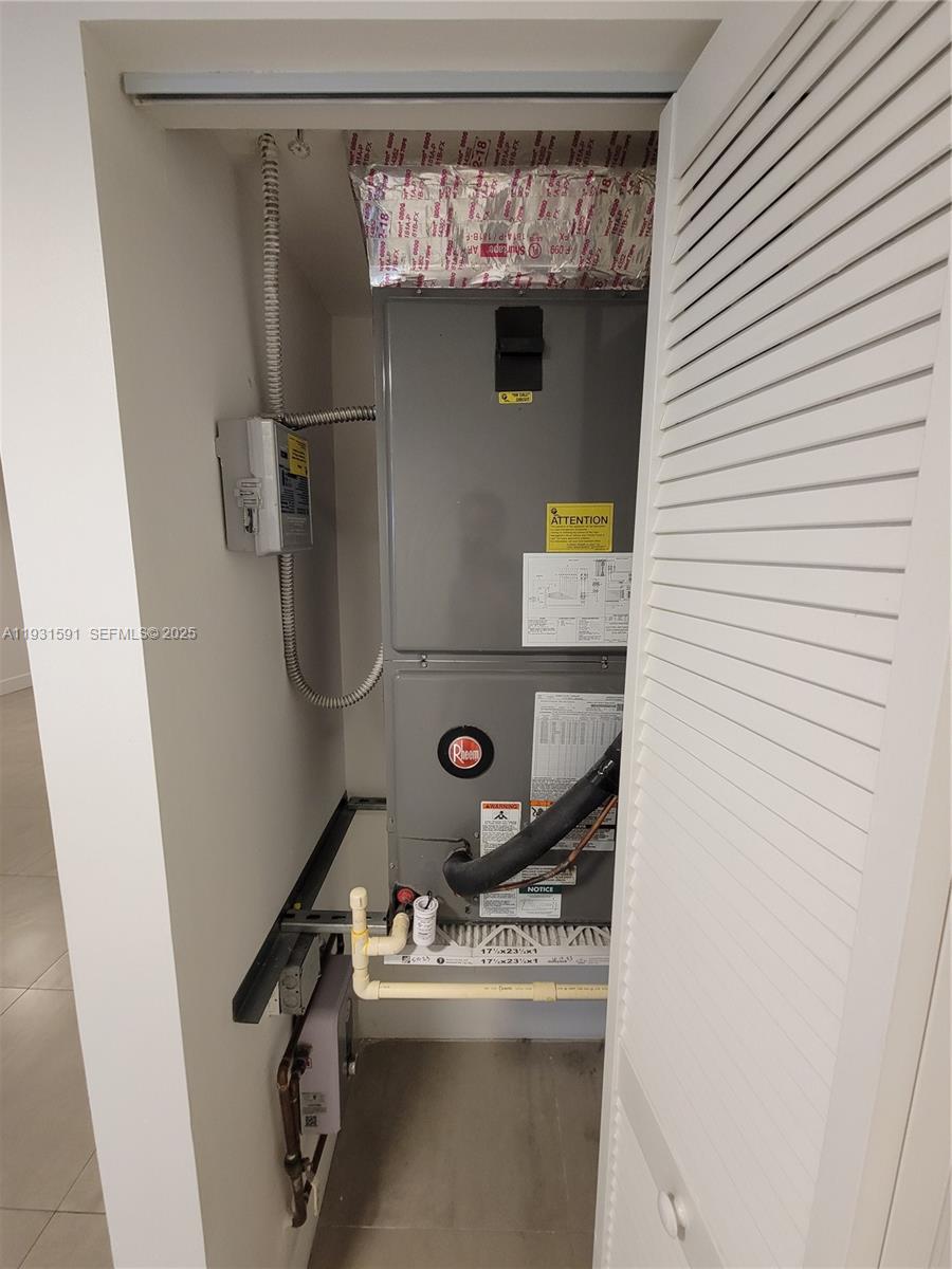 6001 West Flagler Street, Unit 302 Miami, FL 33144 - Photo 9 of 12 a room with storage and utility