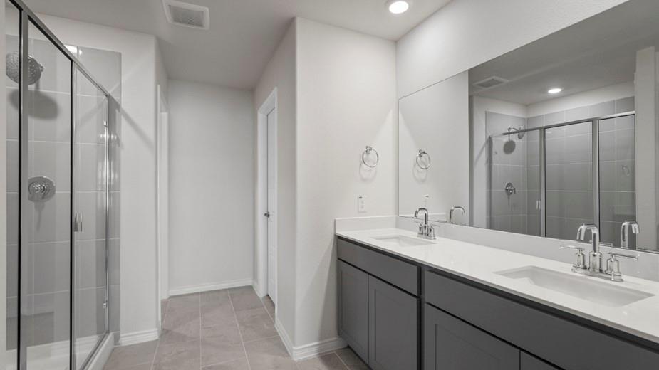 439 Epiphany Lane Lavon, TX 75166 - Photo 17 of 31 Dual vanity with undermount sinks, chrome fixtures, and a white countertop