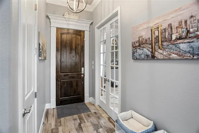 a view of a workspace with furniture and wooden floor