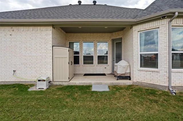 a view of front door of house with yard