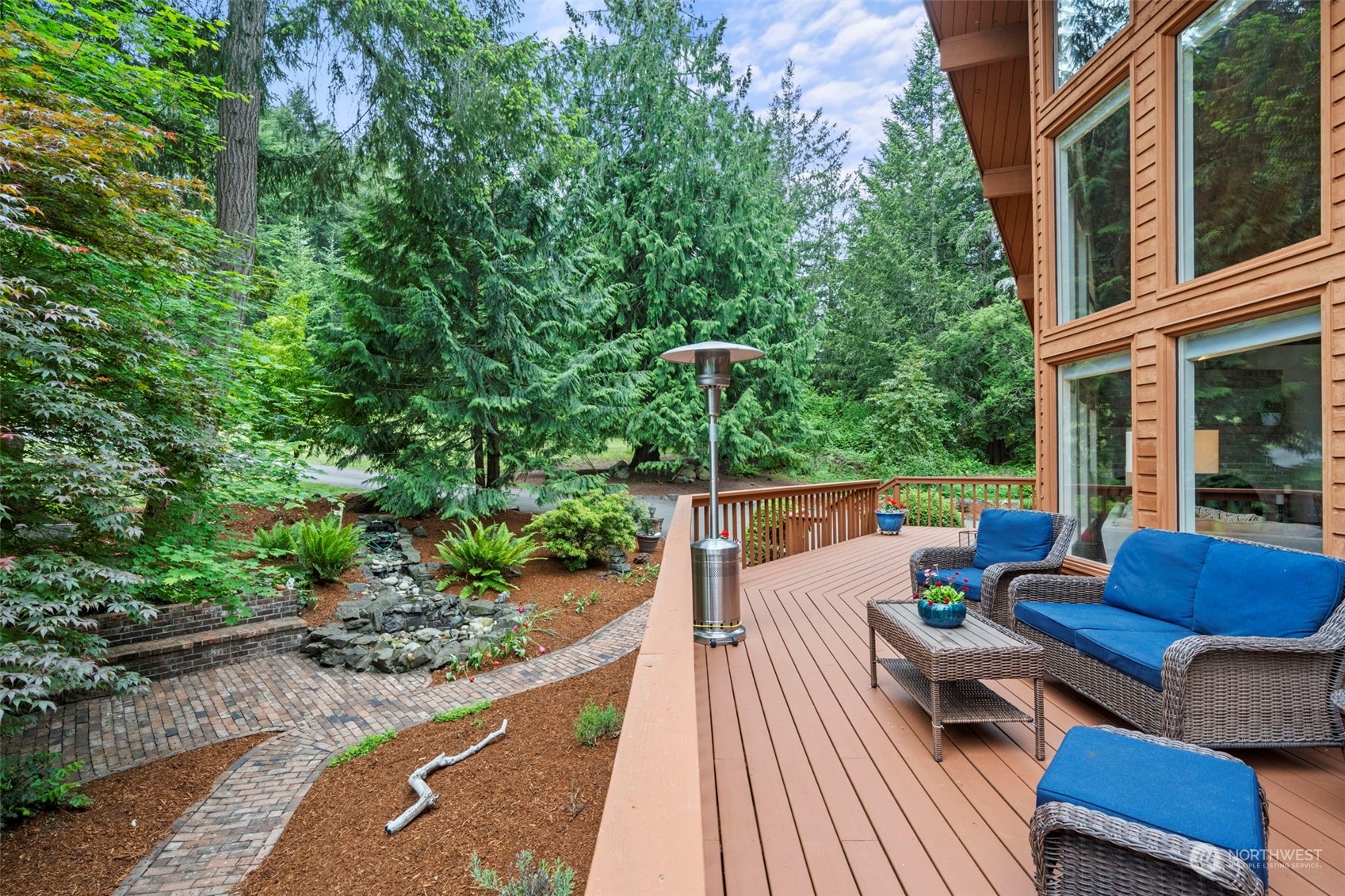 835 Hyak Way Fox Island, WA 98333 - Photo 11 of 38 a view of deck with couches and wooden floor