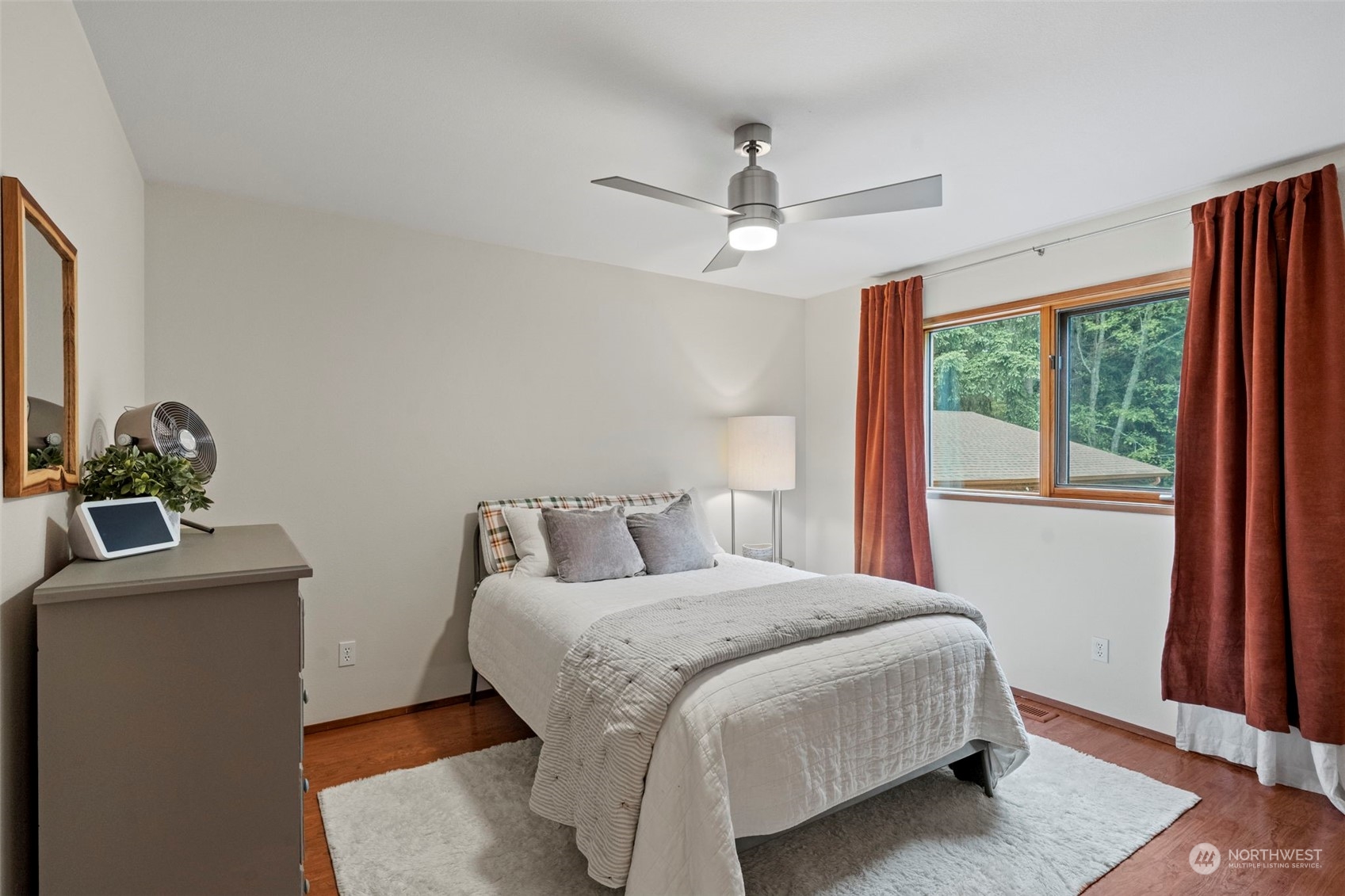 835 Hyak Way Fox Island, WA 98333 - Photo 13 of 38 a bedroom with a bed and a window