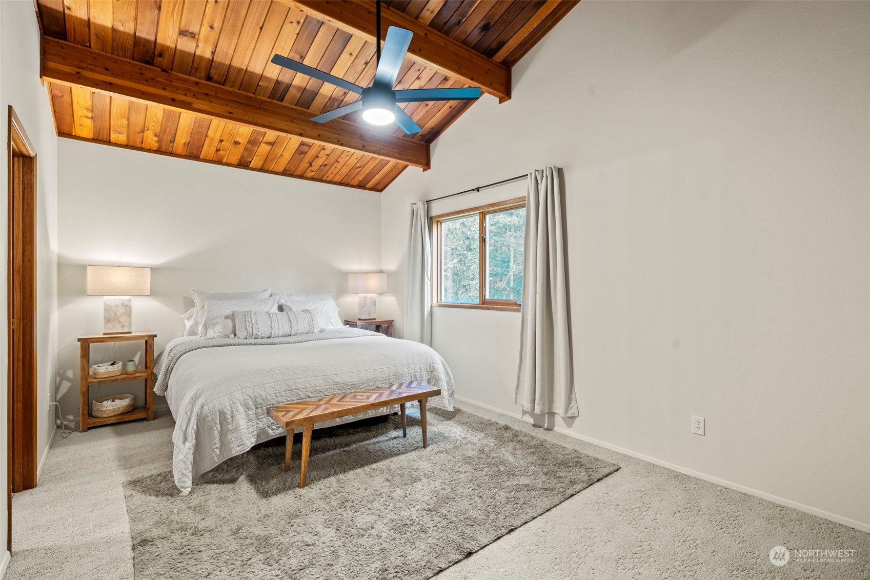 835 Hyak Way Fox Island, WA 98333 - Photo 16 of 38 a bedroom with a bed and a window