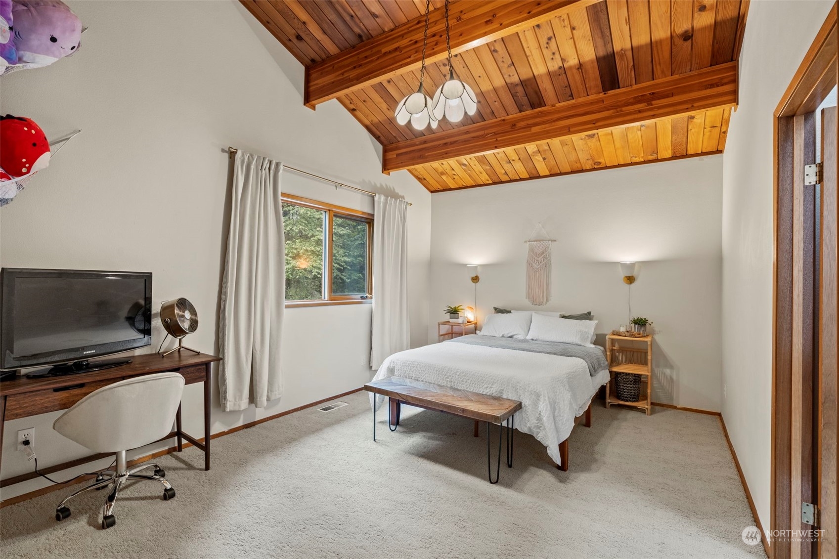 835 Hyak Way Fox Island, WA 98333 - Photo 18 of 38 a bedroom with a bed and a window