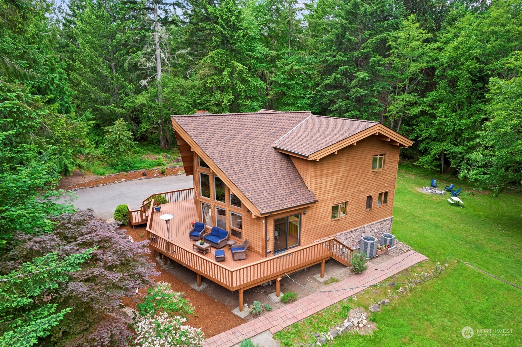 835 Hyak Way Fox Island, WA 98333 - Photo 2 of 38 an aerial view of a house with roof deck front of house