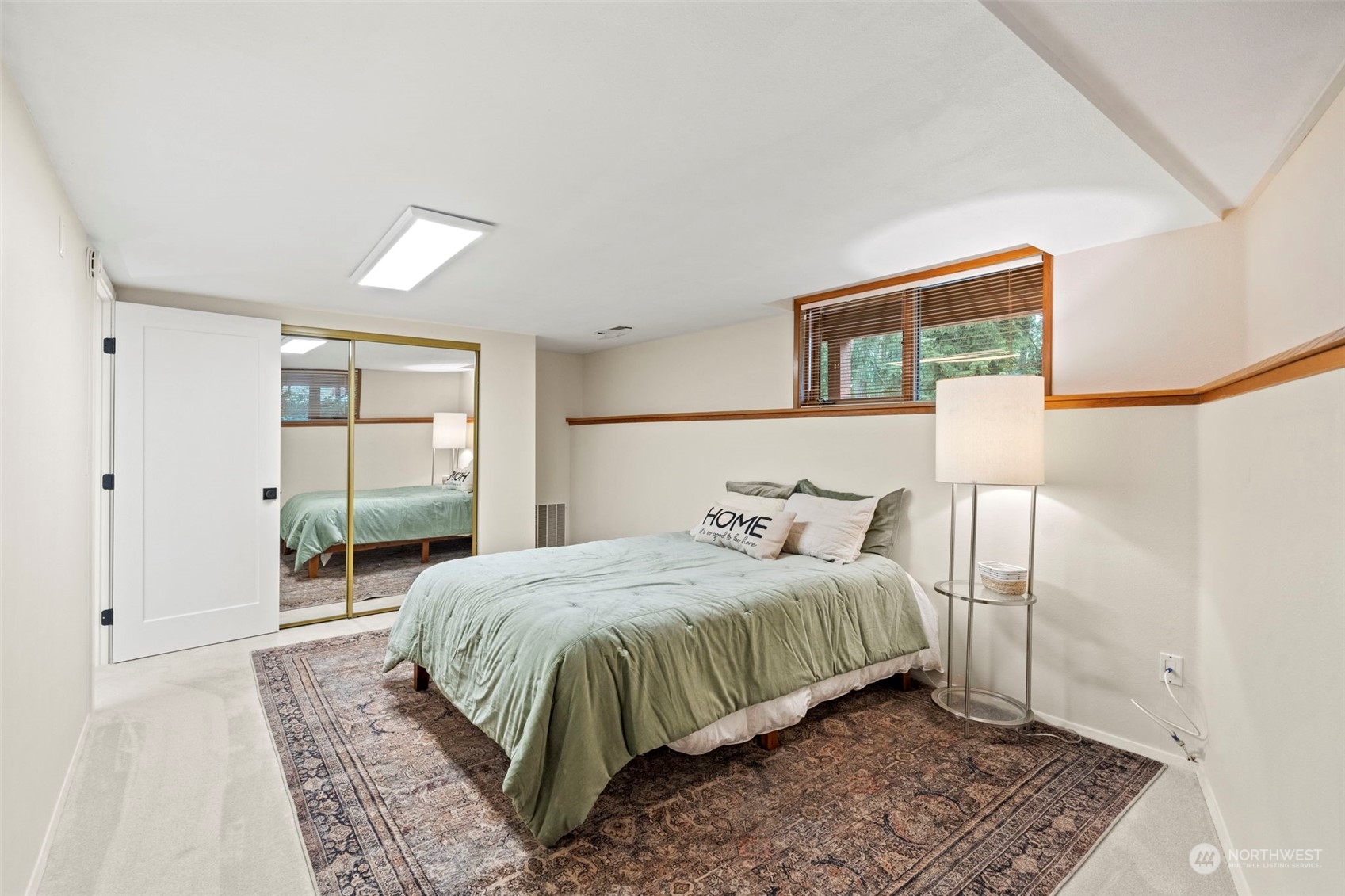 835 Hyak Way Fox Island, WA 98333 - Photo 23 of 38 a bedroom with a bed and a window