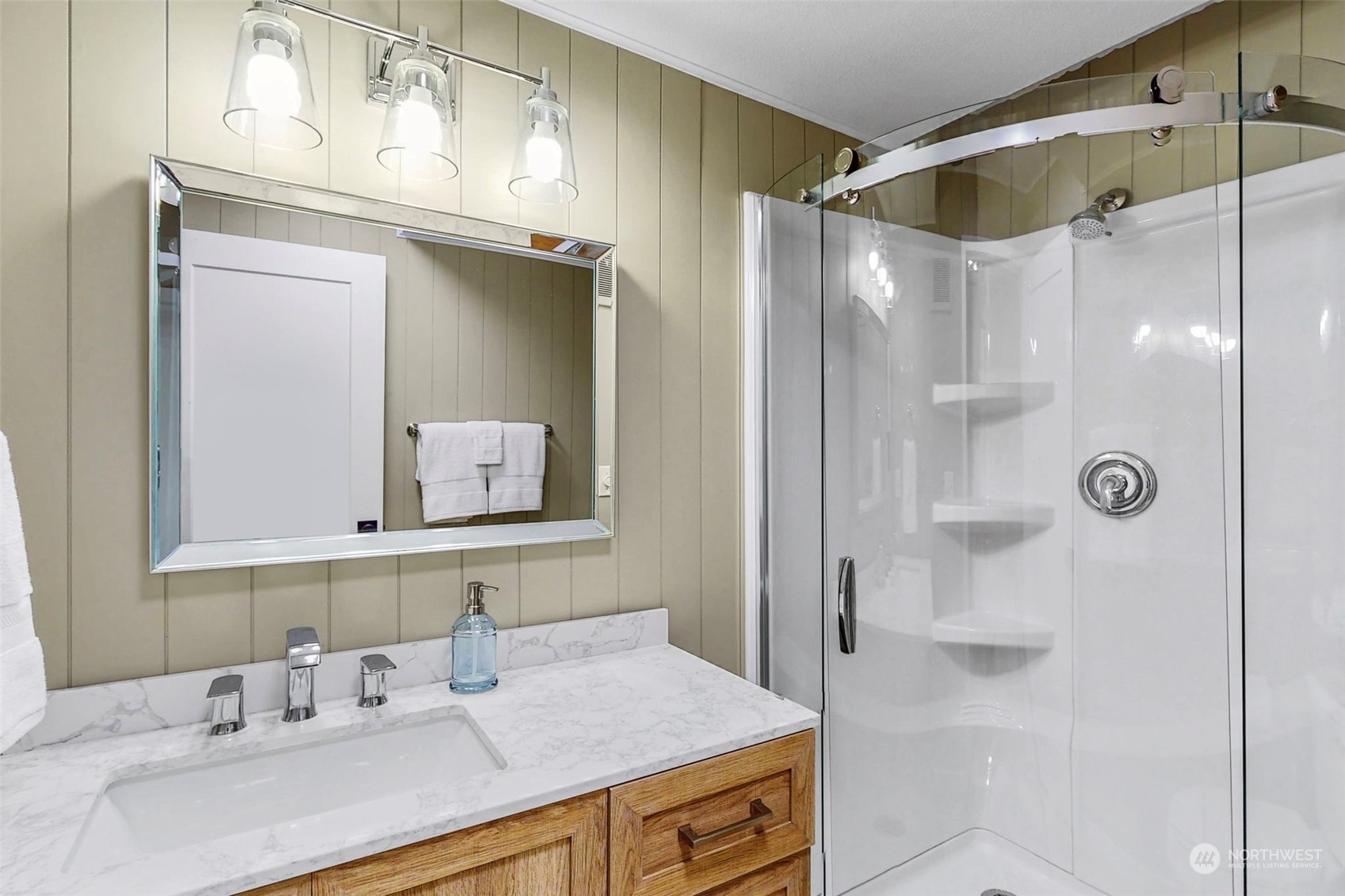 835 Hyak Way Fox Island, WA 98333 - Photo 24 of 38 a bathroom with a granite countertop sink mirror and shower