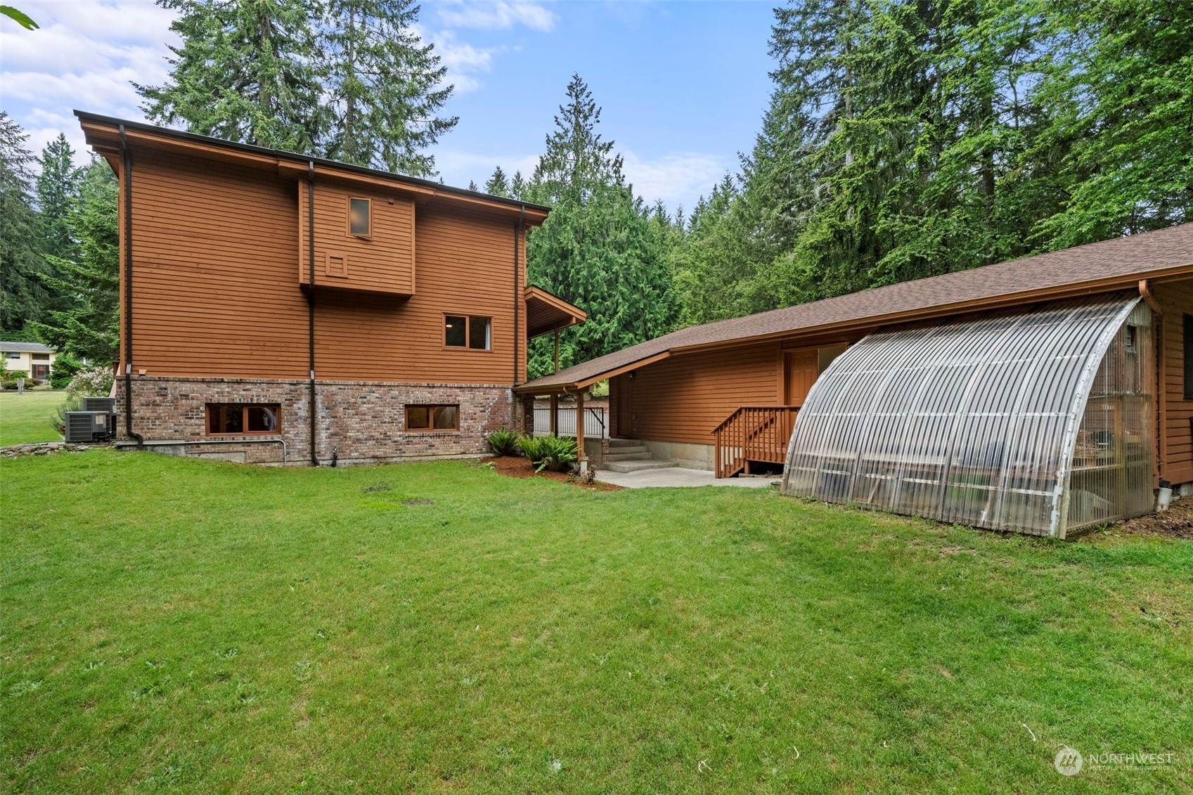 835 Hyak Way Fox Island, WA 98333 - Photo 28 of 38 a view of a house with backyard