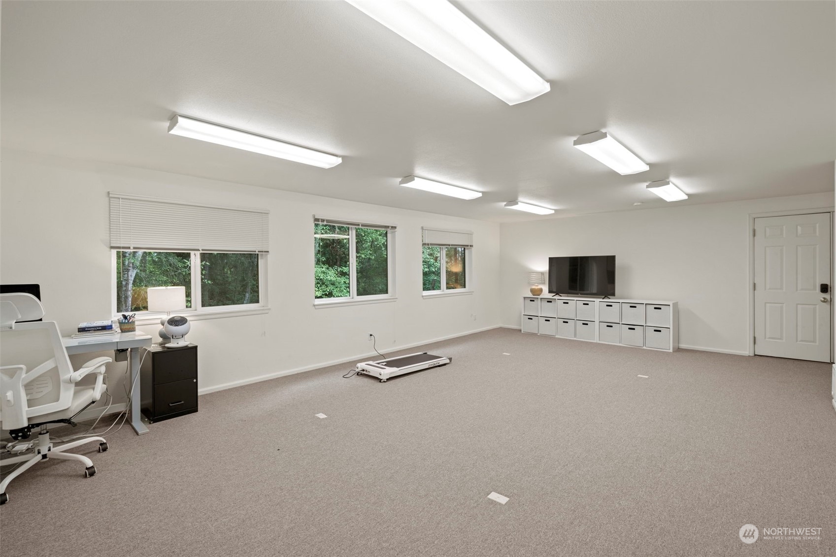 835 Hyak Way Fox Island, WA 98333 - Photo 29 of 38 a view of a livingroom with workspace and a window