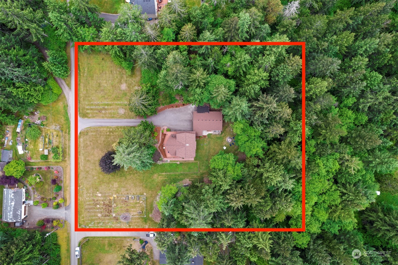 835 Hyak Way Fox Island, WA 98333 - Photo 3 of 38 an aerial view of a flower and yard