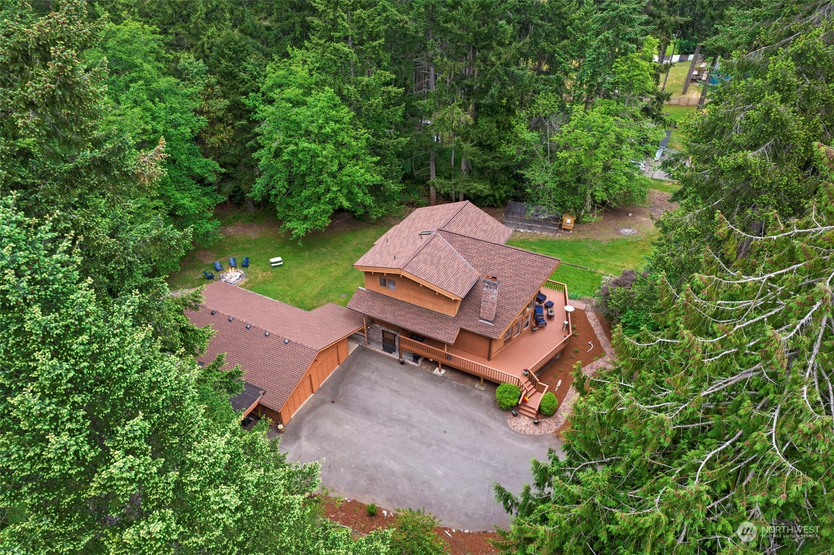 835 Hyak Way Fox Island, WA 98333 - Photo 36 of 38 an aerial view of a house with garden space and street view