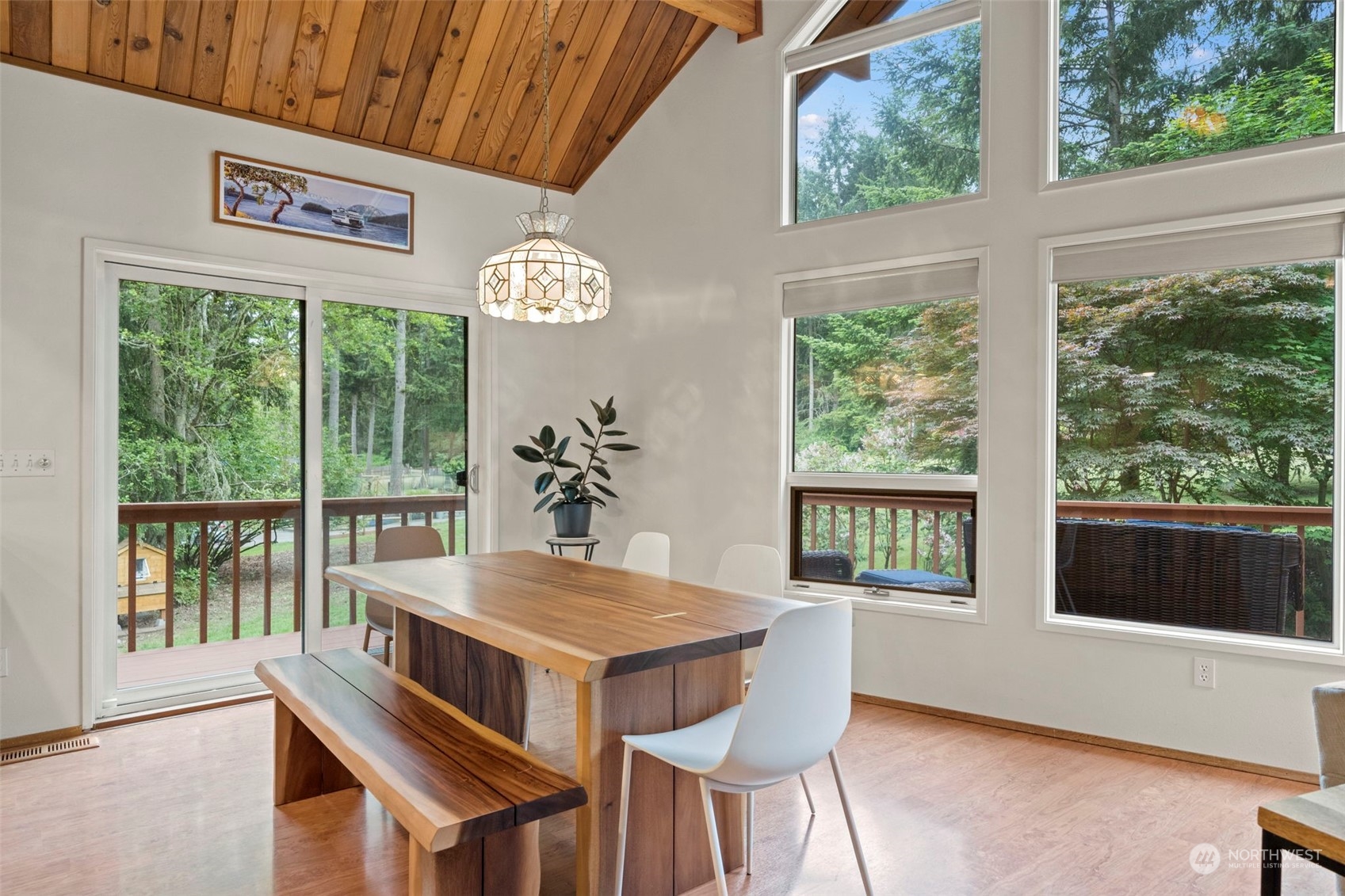 835 Hyak Way Fox Island, WA 98333 - Photo 8 of 38 a view of a dining room with furniture window and outside view