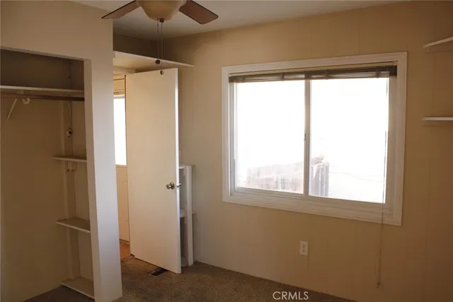 a bathroom with a window and a shower