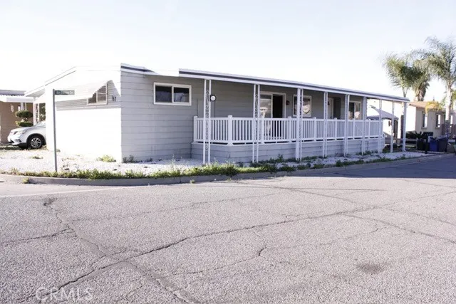 a front view of a house with a yard and a garage