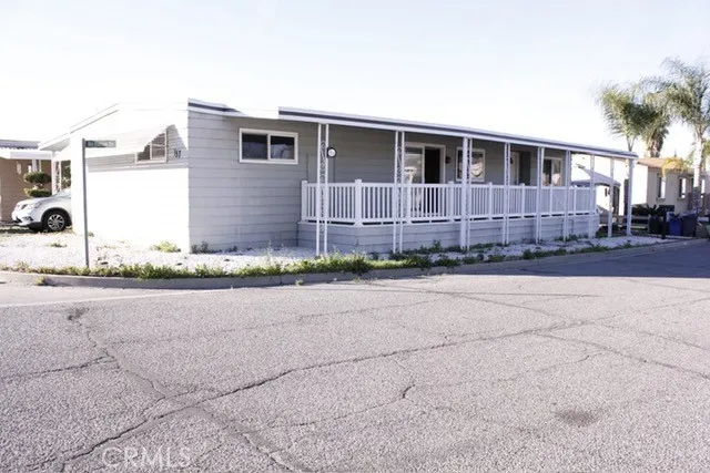 a front view of a house with a yard and a garage