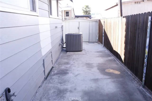 a view of a wooden door and a window