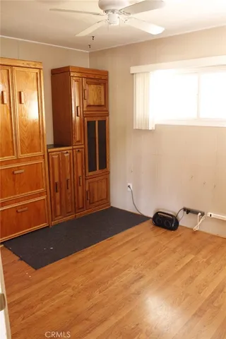 a view of a house with wooden fence