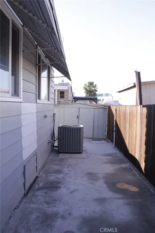 a view of a room with rack and wooden floor