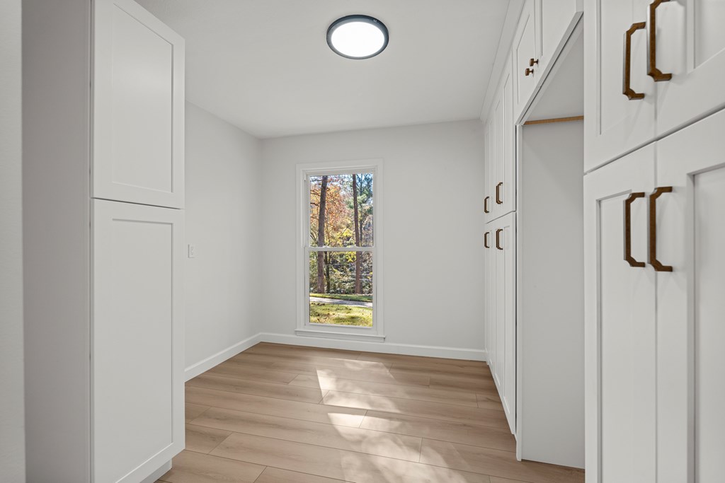 6758 Standing Boy Road Columbus, GA 31904 - Photo 12 of 46 a view of an empty room with window and wooden floor