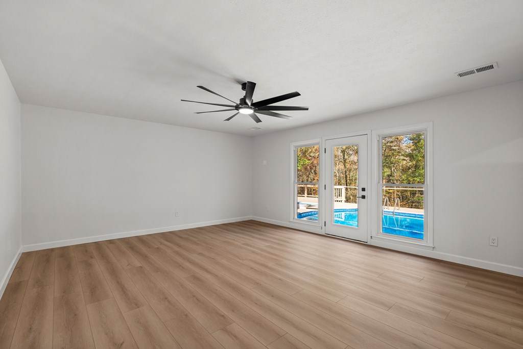 6758 Standing Boy Road Columbus, GA 31904 - Photo 15 of 46 wooden floor in an empty room with a window