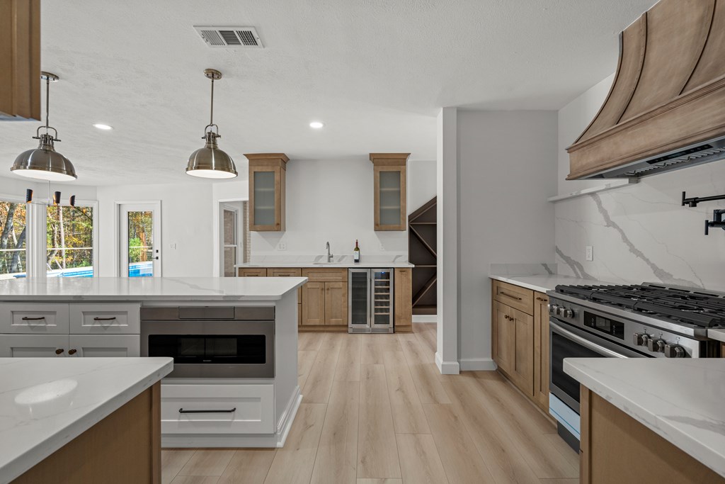6758 Standing Boy Road Columbus, GA 31904 - Photo 6 of 46 a kitchen with granite countertop a stove and a sink