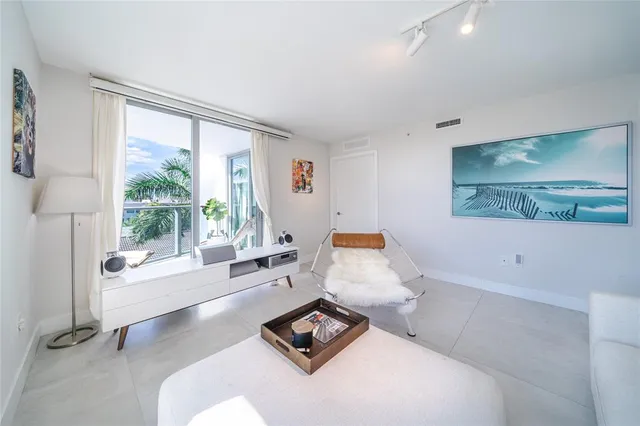 a balcony with tall trees in front of it